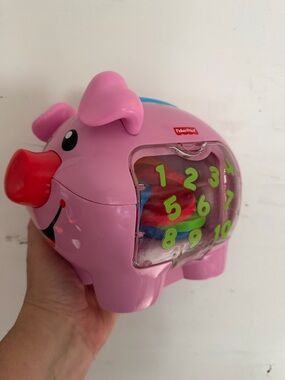 Fisher-Price Pink Piggy Number Sorting Toy with 9 Colorful Discs